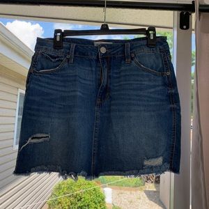 Distressed medium wash denim mini skirt